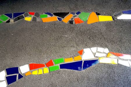 close up color mosaic tile with stone concrete column backgroundの写真素材