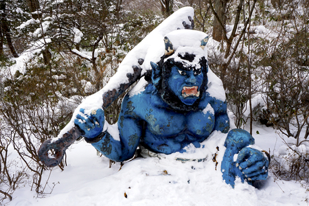 Blue giant myth sculpture at Noboribetsu onsen snow winter national park in Jigokudani, Hokkaido, Japanのeditorial素材