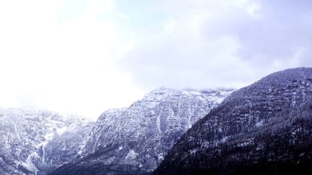 Hallstatt dreamscape winter snow mountain landscape outdoor adventure with blue sky in snowy day,...