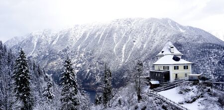 Viewpoint of Hallstatt Winter snow mountain landscape through the forest in upland valley leads to the old salt mine of Hallstatt, Austriaのeditorial素材