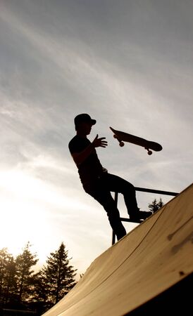 Skateboard catch on sunset