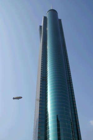 airplane flying to a skyscraper, shenzhen, China