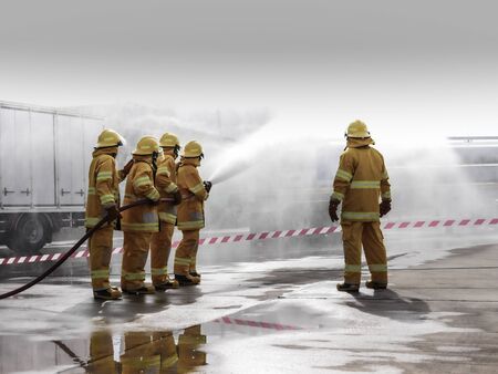 The fire fighting team were handle the emergency situation by spray the water