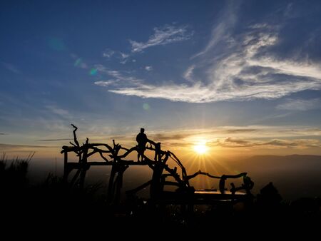 silhouette picture of the man with the sunset background on his travel tripの写真素材