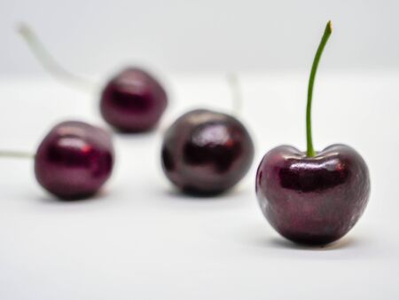 Isolated group of cherry fruit on white backgroundの写真素材