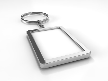 3D rendering illustration of a blank metal keychain with a ring for a key, Isolated on a changeable background. Ideal template for branding, identity guidelines and promo campaigns.の写真素材