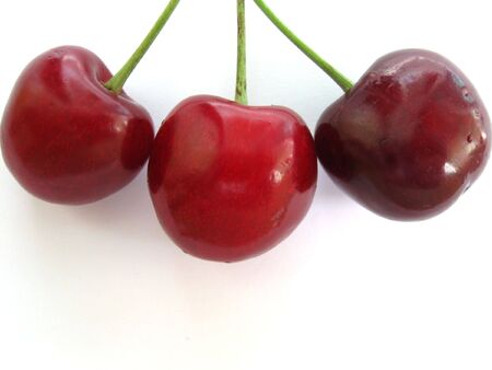 the picture shows a bunch of fresh cherriesの写真素材