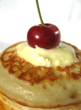 the photo shows a pile of fresh fried pancakesの写真素材