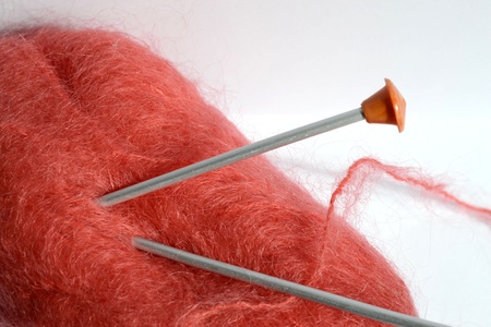 skein of red yarn for knitting with spokesの写真素材