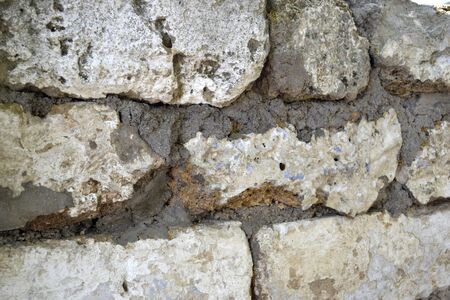 fragment of the old wall of natural stoneの写真素材