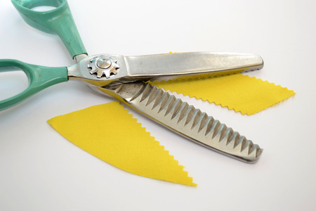  shears curly edges of the material handlingの写真素材