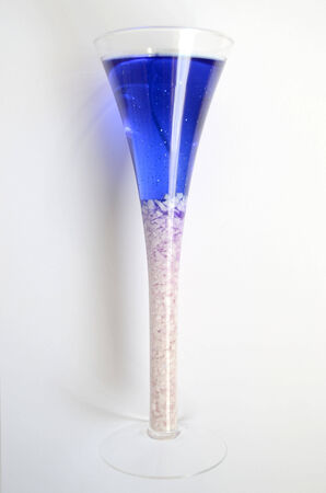 candle wax out of the blue in glassの写真素材
