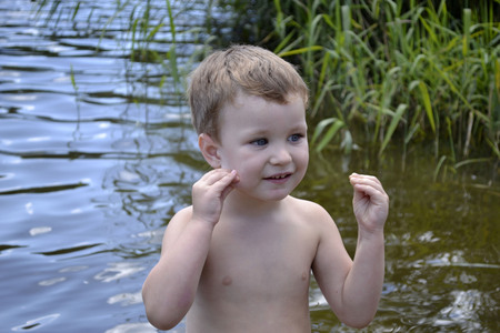 Portrait of a little boy in the summer outdoorsの写真素材