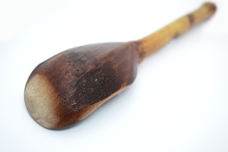 old wooden spoon on white backgroundの写真素材