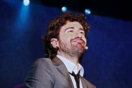 Rome, Italy - April 27, 2012: The comic actor Giancarlo Siani, performs on stage before his fans, during the concert "Regoliamoci" that the State Police organized to sensitize young people to legality.のeditorial素材