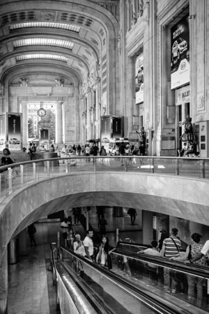 Milan, Italy - August 26, 2013: The lobby of the main station in the new restructuring, with the escalator downstairs.のeditorial素材