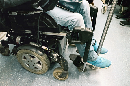 Rome, Italy - 21 January 2016: Disability in wheelchair on a subway car.