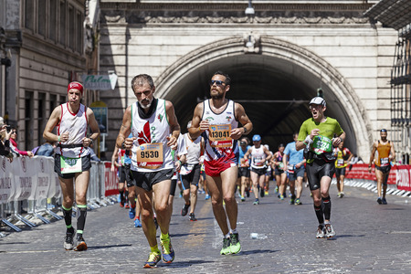 Rome, Italy - April 10, 2016: Athletes participating in the Rome Marathon in 2016 as they pass through the tunnel Umberto I.のeditorial素材