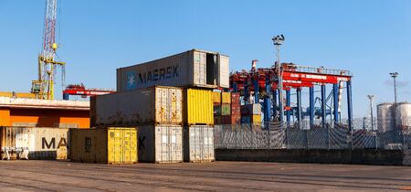 Naples, Italy - August 10, 2016: In the commercial port city, some containers parked waiting for the...