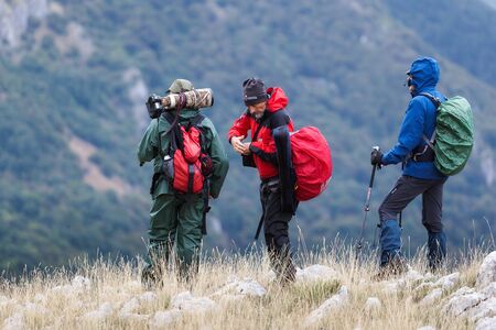 Abruzzo, Italy - September 18, 2016: Three hikers in search of subjects to photograph, on the mountain peaks in the National Park of Abruzzo, Lazio and Molise.のeditorial素材