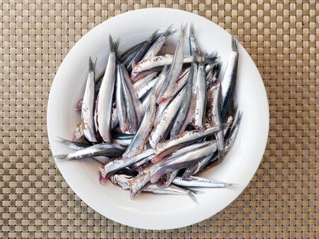 Anchovies headless, cleaned, prepared and ready in the pot, before cooking.の写真素材