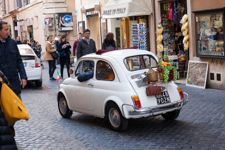 Rome, Italy - November 27, 2016: An old white car of the '70s, a symbol of Made in Italy, the legendary Fiat 500, in the alleys of Rome.のeditorial素材
