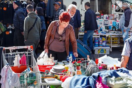 Rome, Italy - February 26, 2017: A woman choose the goods of some outdoor stalls in a suburban marketのeditorial素材