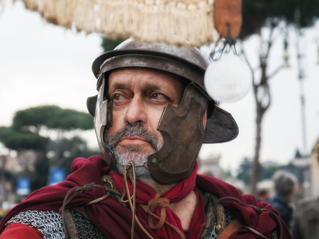 Rome, Italy - April 2, 2017: Roman Gladiator with banner and helmet, taken during the Rome marathon.のeditorial素材
