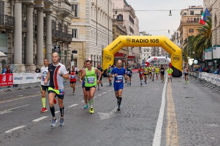 Rome, Italy - April 2nd, 2017: Athletes participating in the 23rd marathon in Rome come to pass in Via Nazionale, a few kilometers from the finish.のeditorial素材