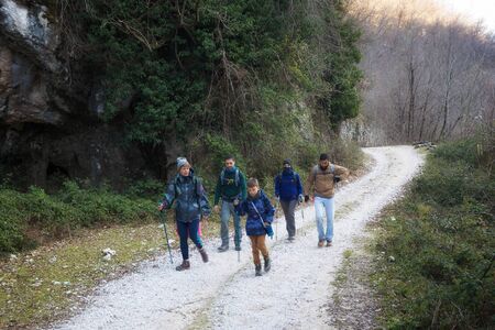 Trevi nel Lazio (FR), Italy - January 28, 2018: Group of hikers crosses a path in the countryside, following the path.のeditorial素材