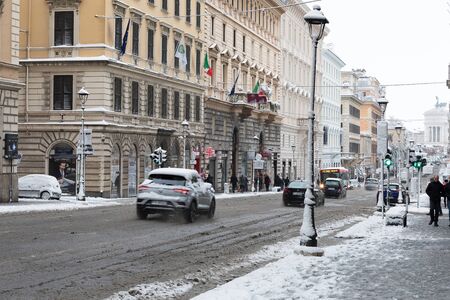 Rome, Italy - February 26, 2018: An exceptional weather event causes a cold and cold air across Europe, including Italy. Snow comes in the capital, covering streets and monuments of a white white coat. In the photo Via Nazionale.のeditorial素材