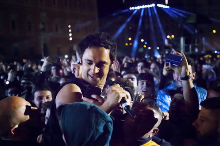 Rome, Italy - May 01, 2018: Cosmo performs on the stage of the concert of the first of May, in Piazza San Giovanni. The Italian singer incites the public in the square and at the end launches in a stage diving between the fans. Credit: Gennaro Leonardi/Alのeditorial素材