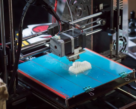 3D printer running while modeling an object.の写真素材