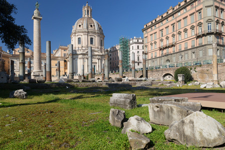 Trajan's Column and Forum: The world's grandest column. In the foreground the columns of the forum of Caesar. In the background on the right, the Church of the Most Holy Name of Mary.の写真素材