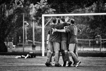 Roma, Italy - May 19, 2019: Exultation of a group of players in front of the opposing goal, immediately after scoring a goal. The goalkeeper lies on the ground in disappointment.のeditorial素材