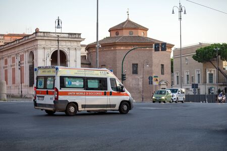 Rome, Italy - August 18, 2019: Ambulance transports sick to the hospital. Inside the patient and nurse are visible. Public health emergency.のeditorial素材