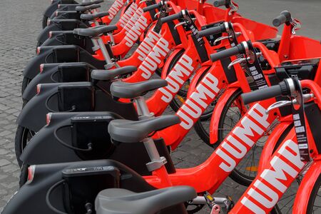Rome, Italy - November 5, 2019: Electric rental bikes in Piazza della Repubblica. Uber Jump, the electrically assisted bike-sharing rental service for getting around the city starts for the first time in the capital.のeditorial素材