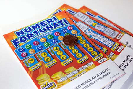 Rome, Italy - December 1, 2019: scratch card lottery, fortune ticket. scratch the lucky numbers with the coin. Illustrative editorialのeditorial素材