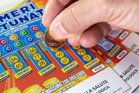 Rome, Italy - December 1, 2019: scratch card lottery, fortune ticket. scratch the lucky numbers with the coin. Illustrative editorialのeditorial素材