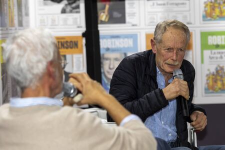 Rome, Italy - December 5, 2019: The writer Erri De Luca conversing with Gregorio Botta inside the Arena Robinson. At the small and medium publishing fairのeditorial素材