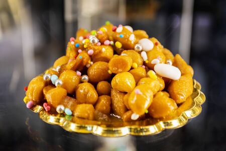 Struffoli, typical Neapolitan pastry consisting of many small balls of dough (realized on paper with...
