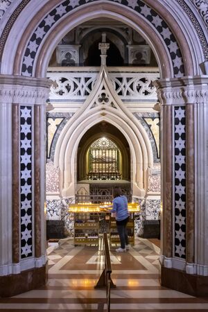 Assisi, Italy - December 7, 2019: Inside the church there is the original crypt with the remains of St. Clare, enclosed in a body-reliquary, which lies inside a crystal urn.のeditorial素材