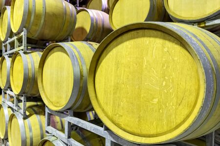Oak barrels for aging the wine in the cellar. Barrels for the fermentation of wine inside a farm.