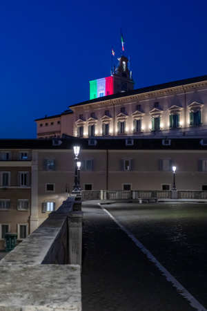 Rome, Italy - April 7, 2020: Piazza del Quirinale in the evening in the blue hour, illuminated with the colors of the Italian flag, on the bell tower of the Palazzo del Quirinale, seat of the President of the Republic.のeditorial素材