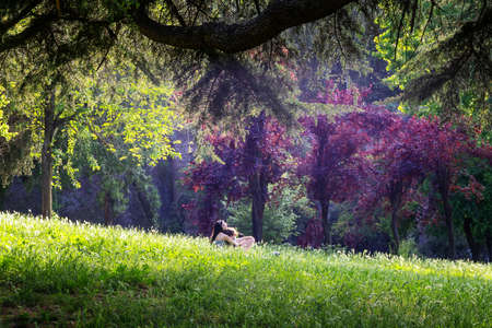 Rome, Italy - May 10, 2020: Villa Borghese, a couple of enjoys the freedom of being outdoors in the public park after the end of the restrictions due to the coronavirus pandemic.のeditorial素材