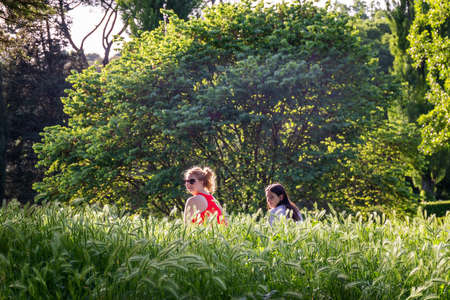 Rome, Italy - May 10, 2020: Villa Borghese, two girls enjoy the freedom of being outdoors in the...