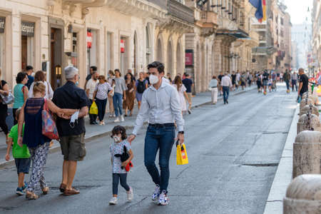Rome, Italy - September 20, 2020: People walking in the streets of the city wearing protective masks to protect themselves from the Covid-19 pandemic.のeditorial素材