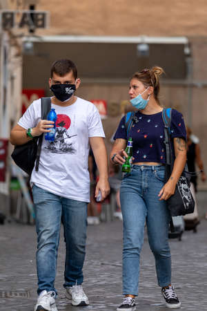 Rome, Italy - September 20, 2020: People walking in the streets of the city wearing protective masks to protect themselves from the Covid-19 pandemic.のeditorial素材