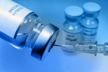Drawing the Covid-19 vaccine with a syringe.の写真素材