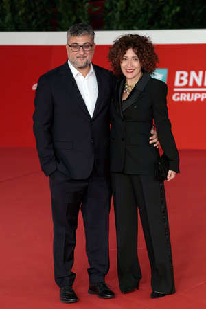 Rome, Italy - October 15, 2021: Giuseppe Bonito and his wife parade on the red carpet of the film L'Arminuta, at the Rome Film Festival, Auditorium Parco della Musica.のeditorial素材